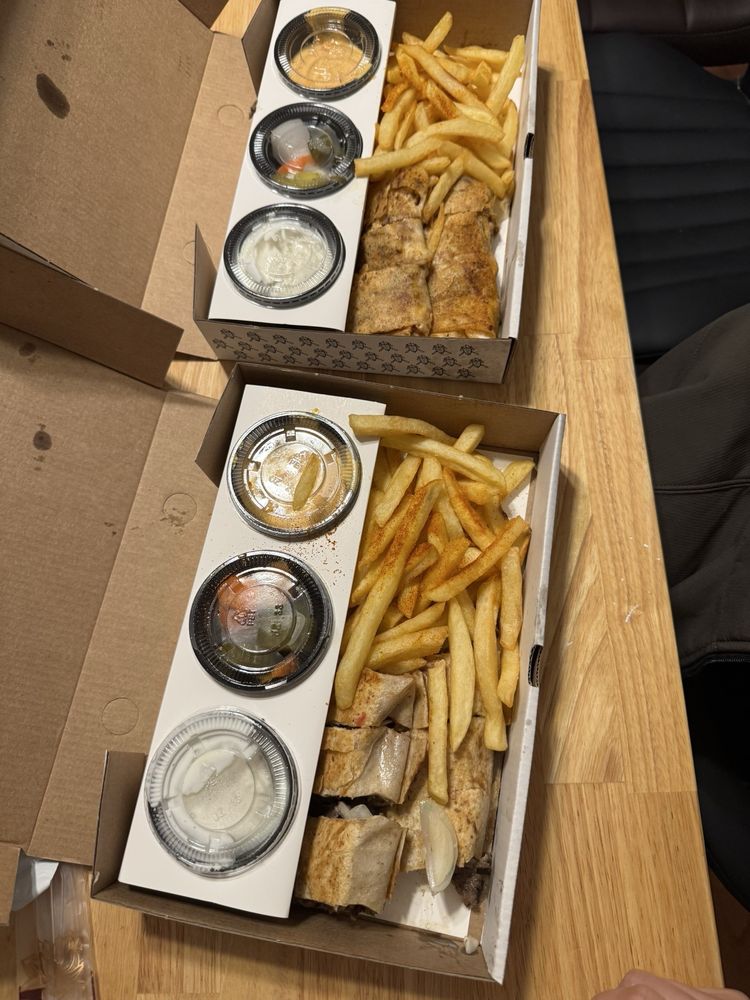 Shawarma with fries and sides at Shawarma Al-Sham