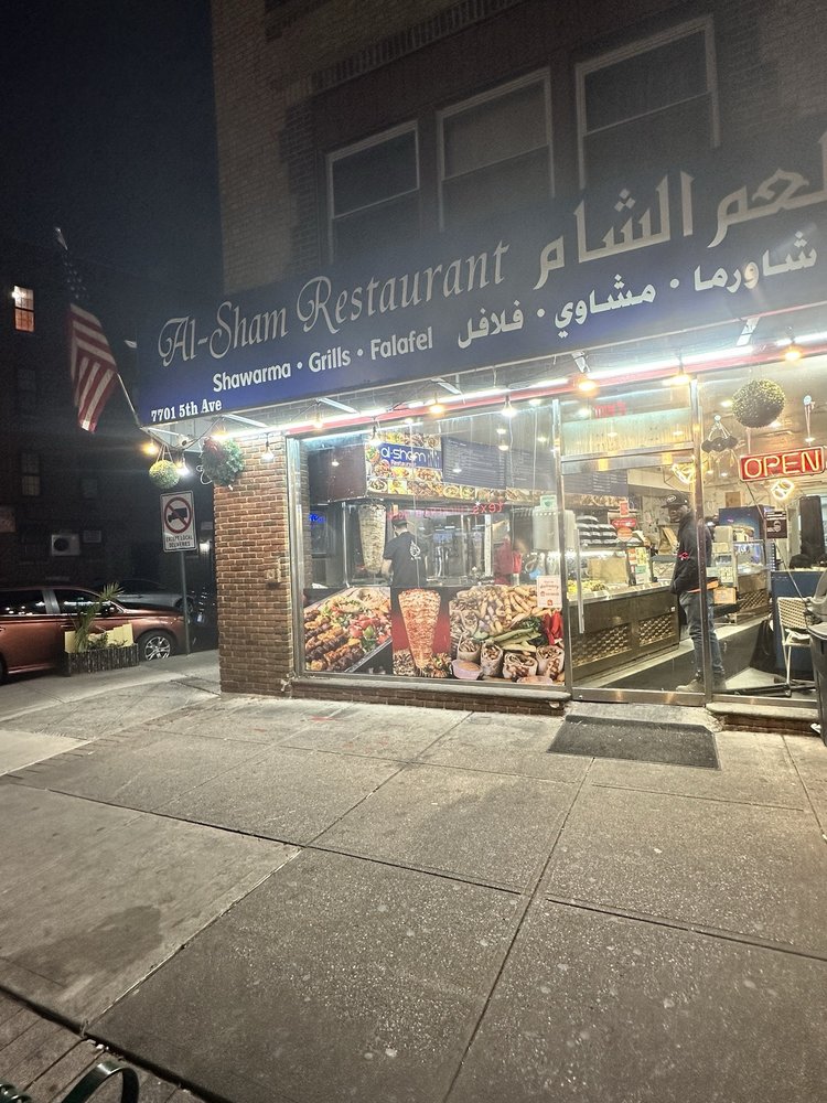 Shawarma Al-Sham storefront on 5th Avenue at night